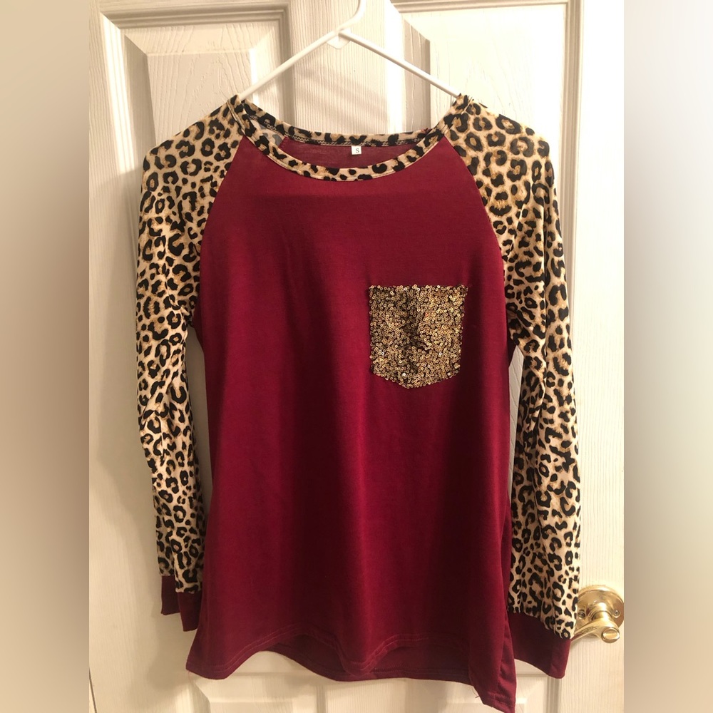 Maroon Long Sleeve Shirt With Cheetah Sleeves and Gold Front Pocket Size Small
